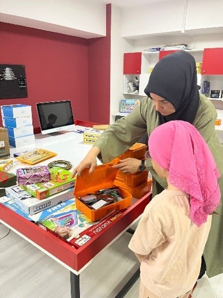 A group of children around a tableAI-generated content may be incorrect.