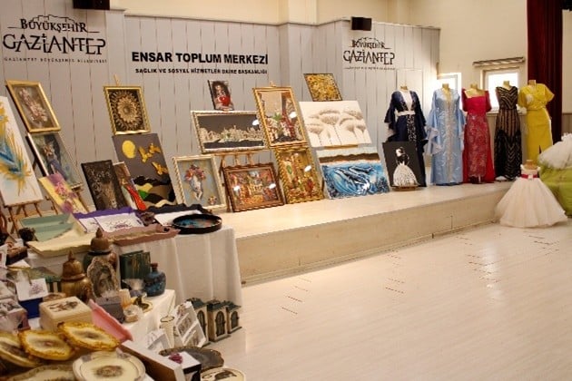 Several women sewing at a tableAI-generated content may be incorrect.