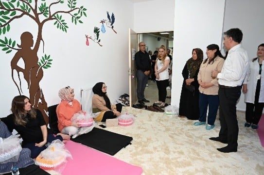 A person giving a box to a group of womenAI-generated content may be incorrect.