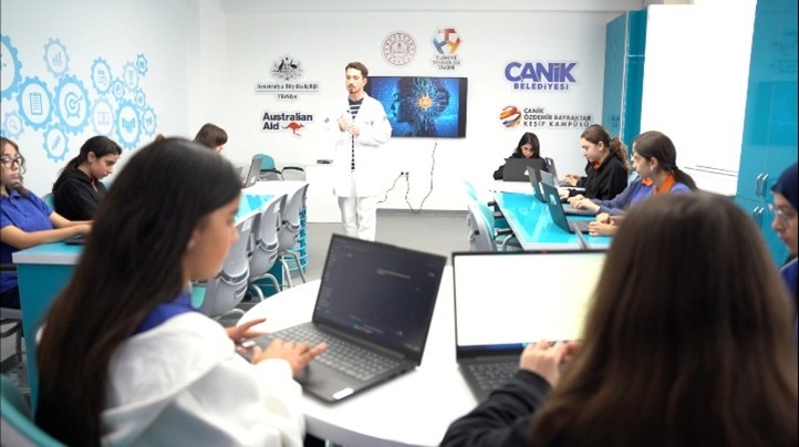 A person in a white coat using laptopsAI-generated content may be incorrect.