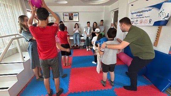 A group of people on a playgroundAI-generated content may be incorrect.